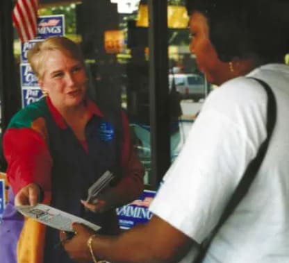 A woman is talking to someone outside